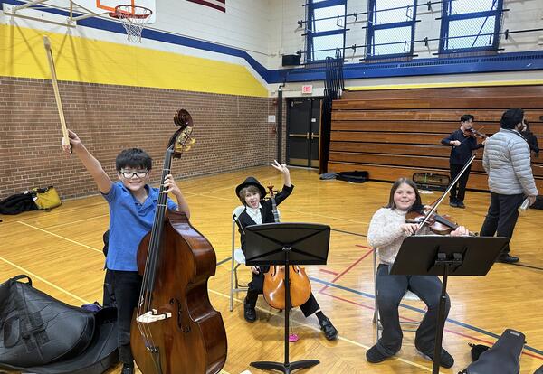 D64 musicians waving at the 2026 orchestra solo and ensemble