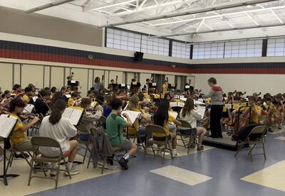 D64 students perform at the Orchestra Clinic at Emerson Middle School