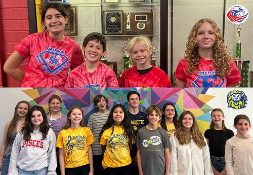 Students wearing Red and Yellow Emerson and Lincoln Music Department Shirts Standing Together in a Line.