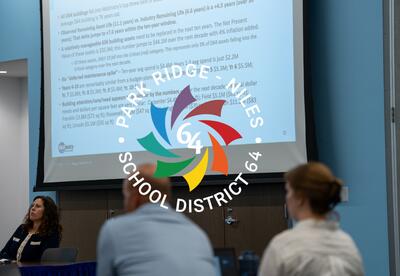 Presentation on a screen in a conference room with the Park Ridge-Niles District 64 Logo.