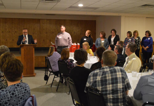 Superintendent Mayfield with the staff celebrating 25 Years of Service