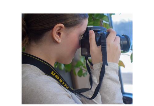 Two KHS male students in the working on wiring an outlet