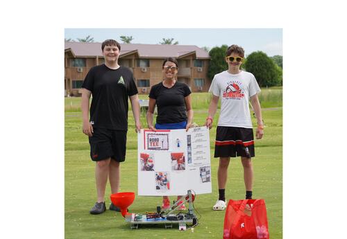 JRG teacher and students showing off ROBO-Tee at the 2026 KASD golf outing