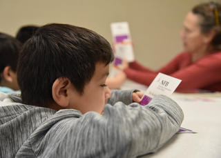 kid reading braille 