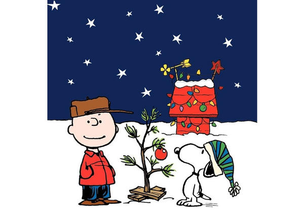 Charlie Brown and Snoopy with Scrawny Christmas Tree in Front of Snoopy's Christmas Light Decorated Doghouse