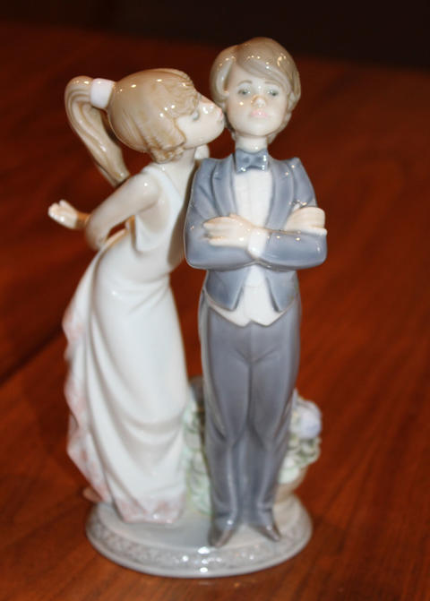 "Lets Make Up" figurine showing a girl kissing a young lad