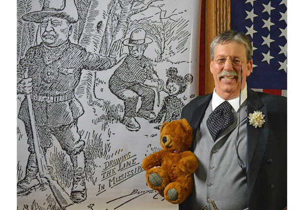 Derek Evans Dressed as Teddy Roosevelt Holding a Teddy Bear