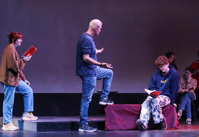 CCC Theatre Director Matthew Smith rehearsing with students.