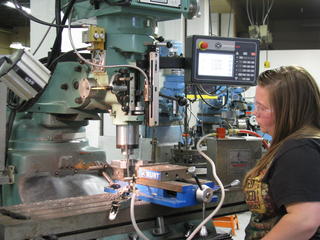 Female Student in Machine Shop