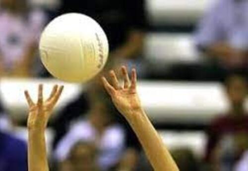 photo of volleyball with hands