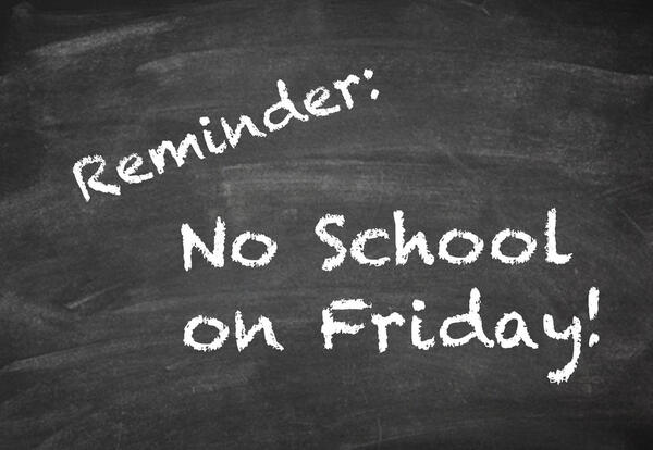 Post-it note with text saying Reminder: No School!