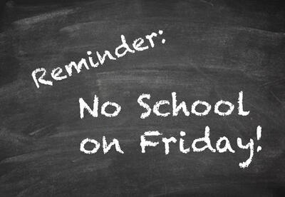 Post-it note with text saying Reminder: No School!