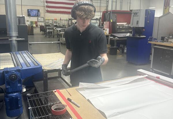 student working in the manufacturing process