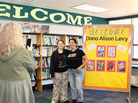A photo of Mrs. Gammeri taking a photo of the author with a student
