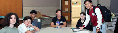 Students enjoying a pizza lunch with author Dana Alison Levy