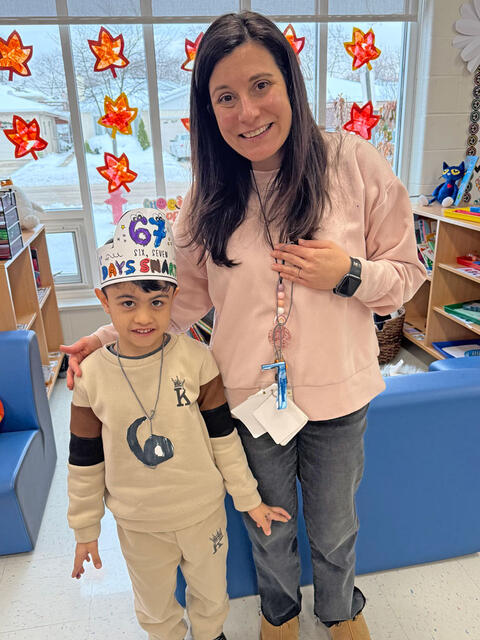 kindergarten student and teacher celebrate 6 7 Day