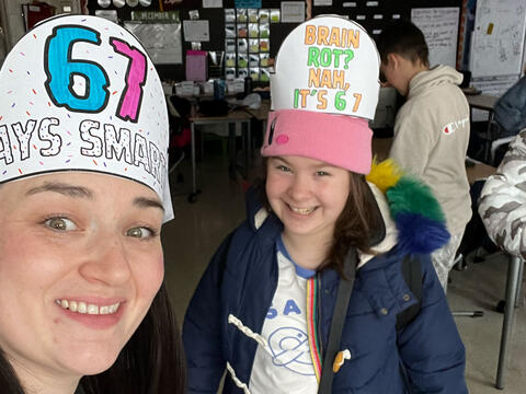 photo of teacher and student celebrating 6 7 Day