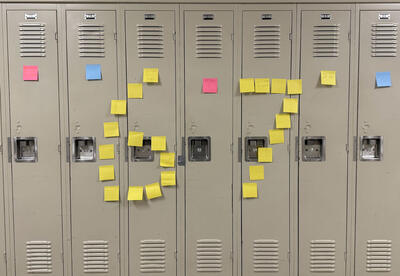 photo of 6 7 displayed with yellow stickie notes