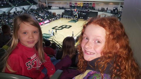 students at basketball game